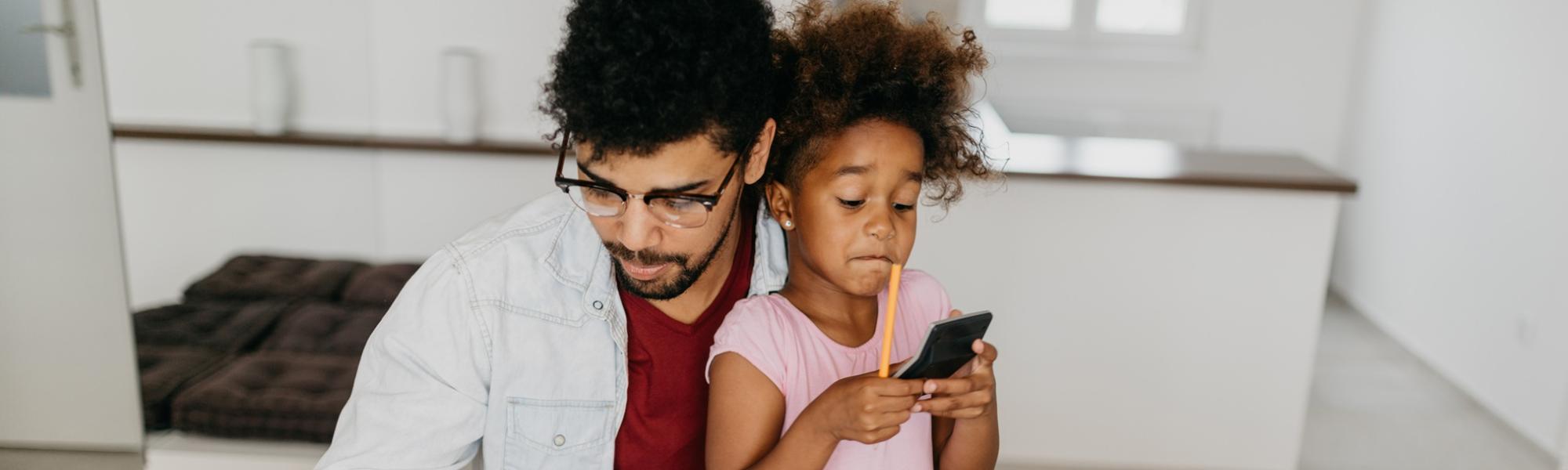 man with child doing paperwork