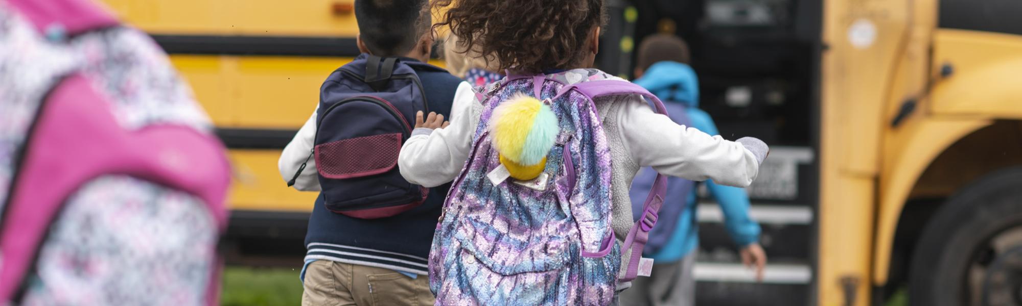 Girl running for bus with backpack
